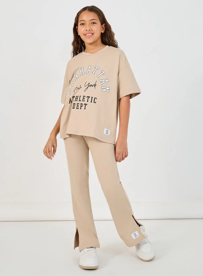 Styli Graphic Print Round Neck T-Shirt & High Rise Pants Co-Ord Set (Women, Medium) 7c8dg